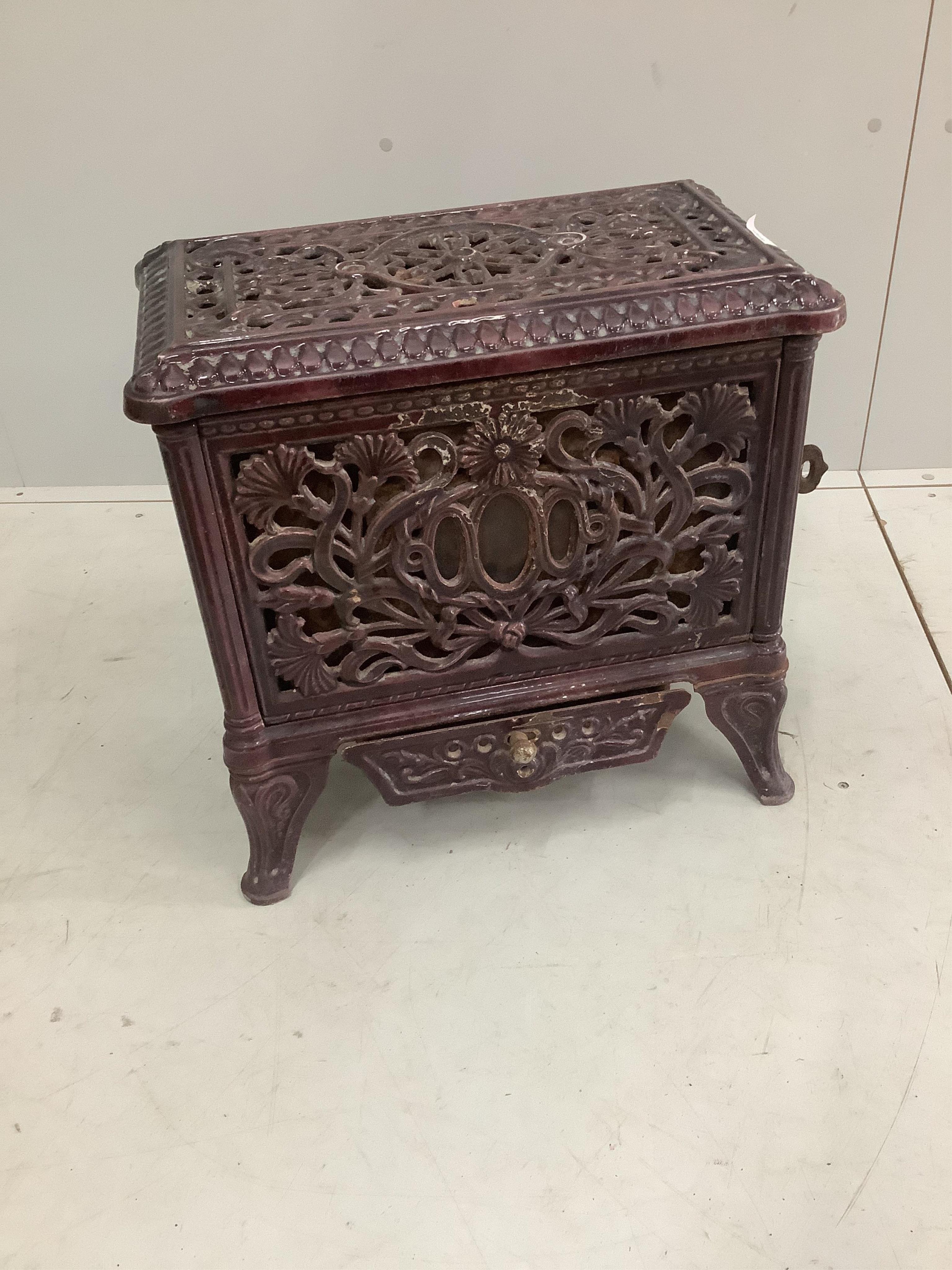 A late 19th / early 20th century French enamelled heater, width 51cm, depth 31cm, height 50cm. Condition - fair